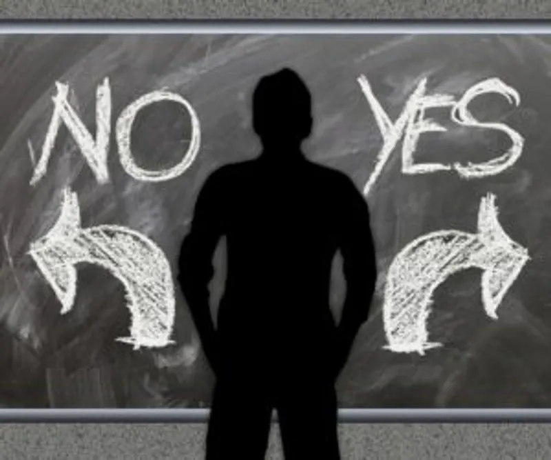 Silhouette standing between NO and YES with arrows pointing in opposite directions