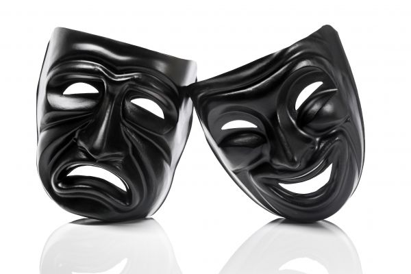 Black theater masks with frowning and smiling faces