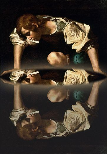 Crouching person looks down at their reflection on a dark reflective surface