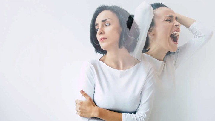 Two overlapping figures, one looking aside and one with mouth open and hands on head