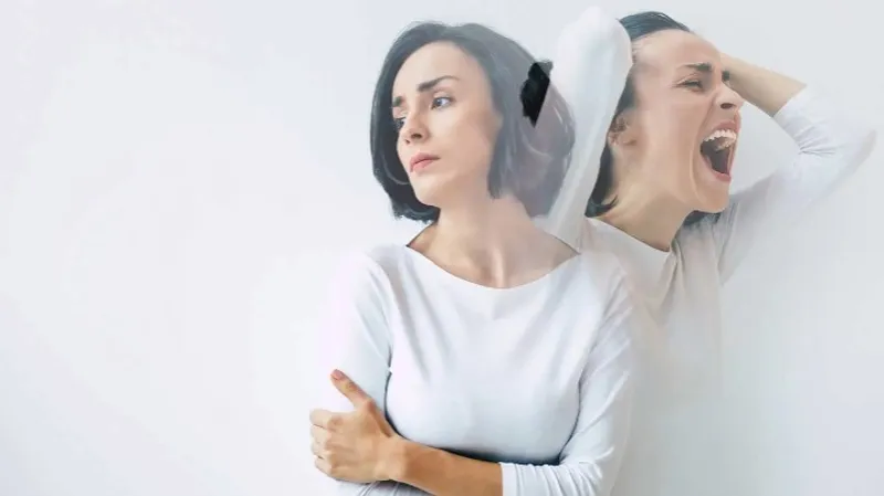 Two overlapping figures, one looking aside and one with mouth open and hands on head