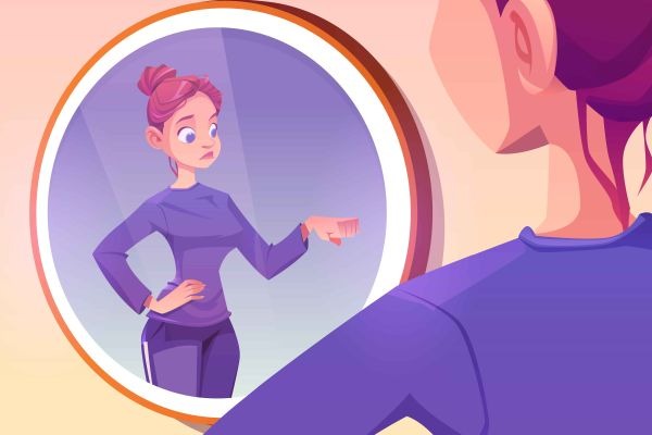 Person faces a round mirror as their reflection points back at them