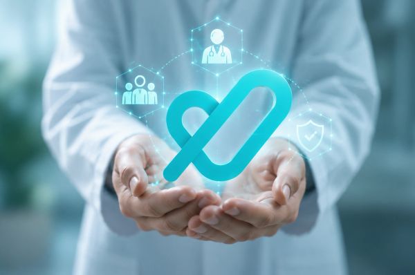 Doctor holding glowing Tatmeen logo with digital care and security icons