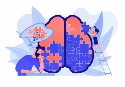 Two people assemble puzzle pieces forming a large brain