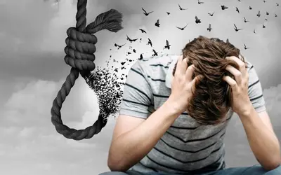 Seated person holds their head beside a hanging noose and a dissolving silhouette
