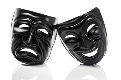 Black theater masks with frowning and smiling faces