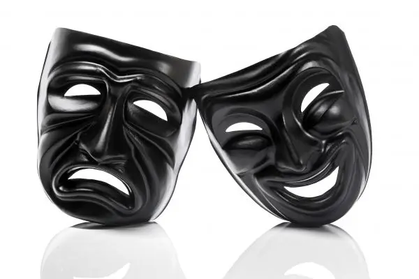 Black theater masks with frowning and smiling faces