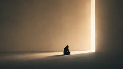 Man sitting alone in a dim room, facing a narrow opening with warm light entering