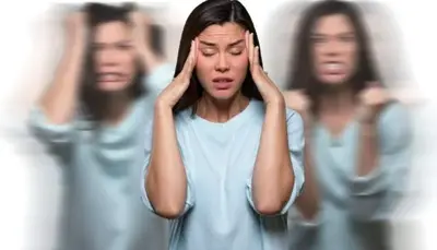 Person pressing both hands to their temples, with blurred duplicates on either side