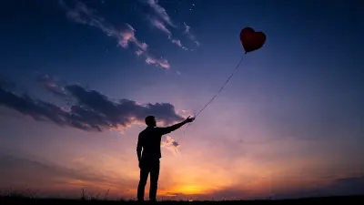 Man releasing a heart-shaped balloon into a twilight sky, symbolizing letting go