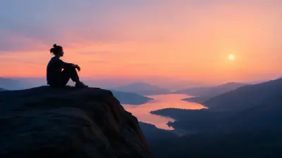Person sitting on a cliff at sunset overlooking a calm river and mountains