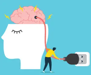 Small figure pulls a cable linking an exposed brain to a wall plug